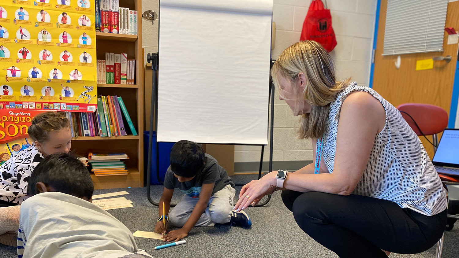 Photo of Ashley Nagel in the classroom working with her ELL students