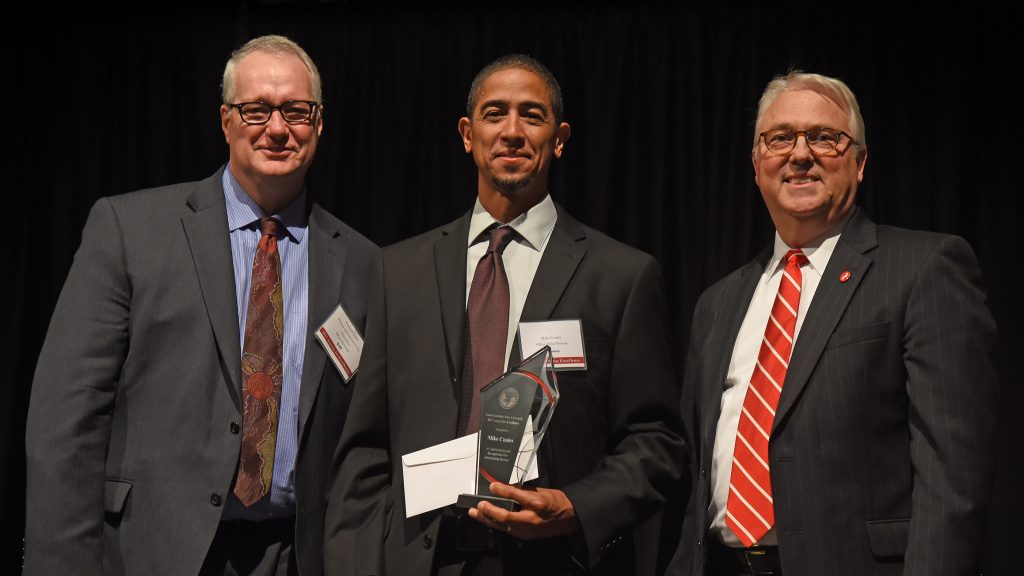 Photo of Provost Warwick Arden, Mike Cuales and Chancellor Randy Woodson