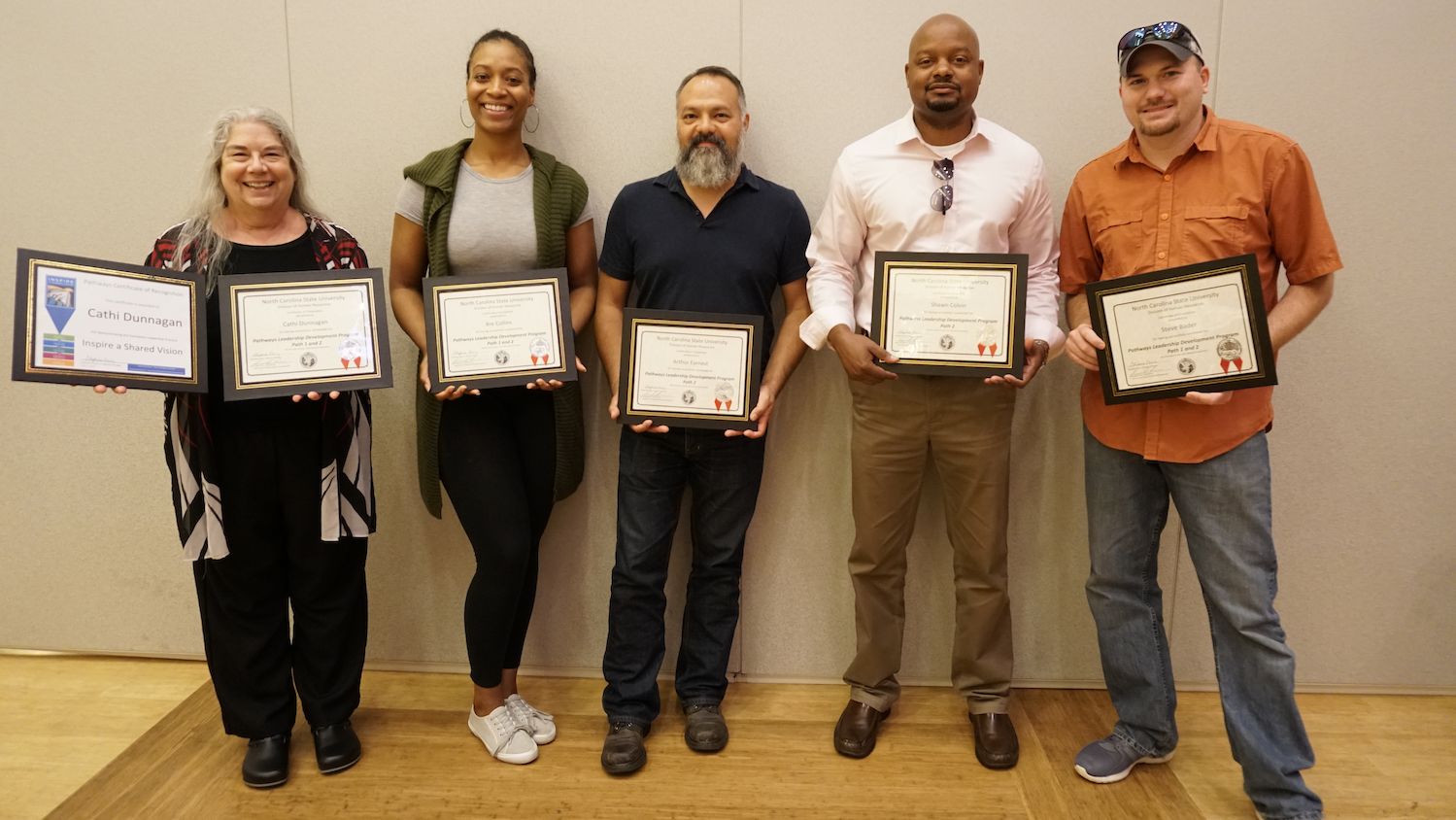 Photo of Cathi Dunnagan, Breanna Collins, Arthur Earnest, Shawn Colvin and Steve Bader with their Pathways graduation certificates