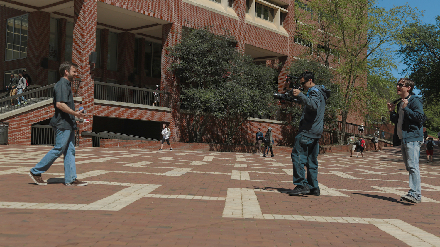 Todd Buker directing, Michael Castro filming professor in Statistics juggling