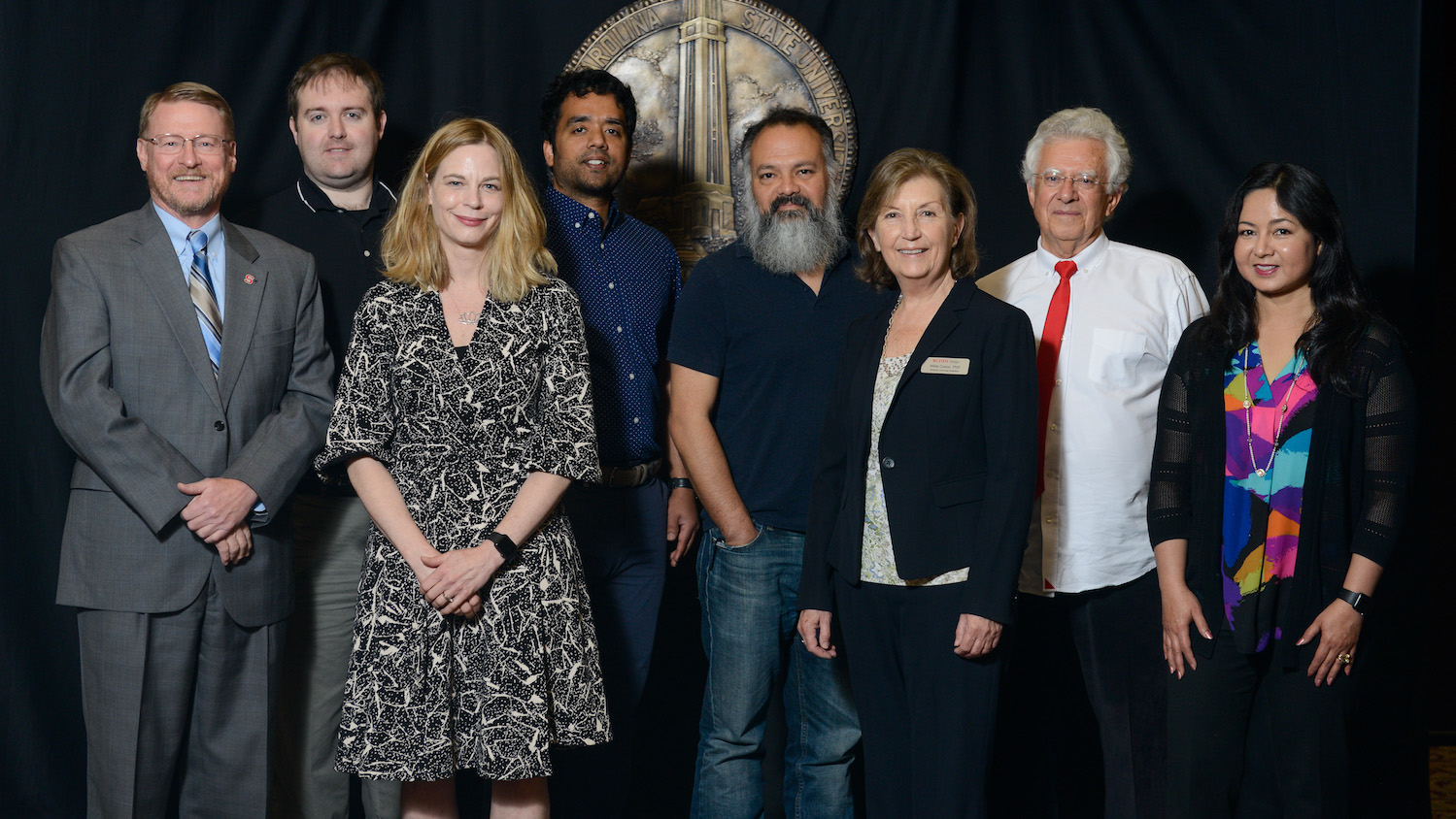 L-R: Senior Vice Provost Duane Larick, Jason King, Helen Armstrong, Muntazar Monsur, Arthur Earnest, Nilda Cosco, Robin Moore, Jakia Salam. Photo by Marc Hall.