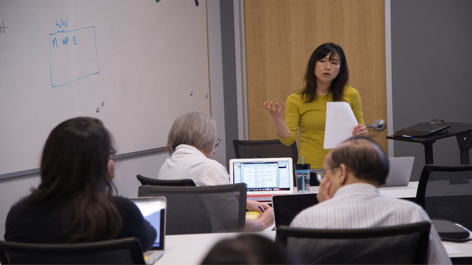 Yiling Chappelow at front of class leading a workshop.