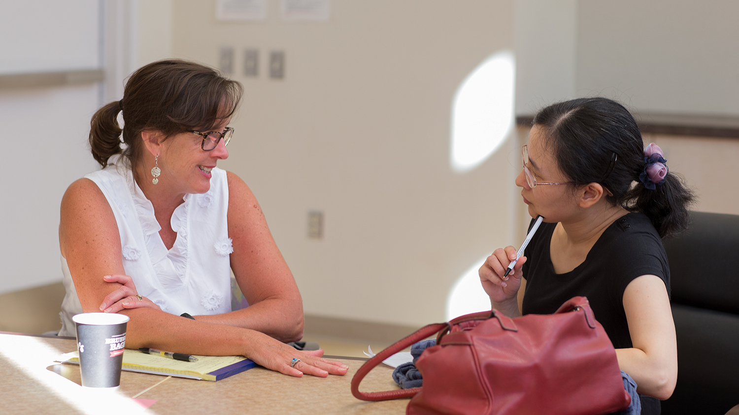DELTA staff member Yan Shen works with a faculty member at the DELTA Grants Orientation.