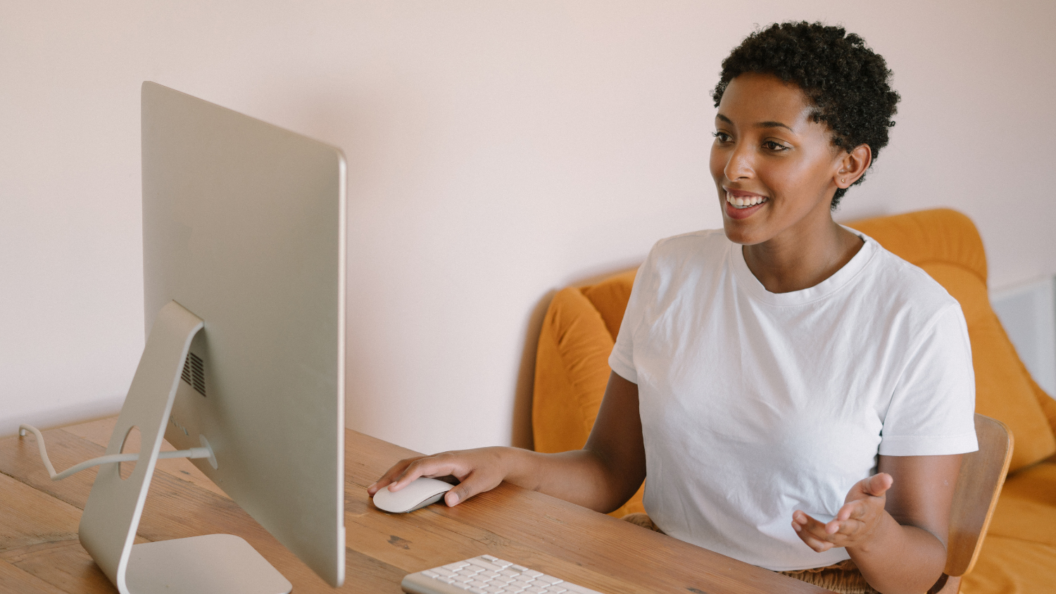 Woman converses via her computer.