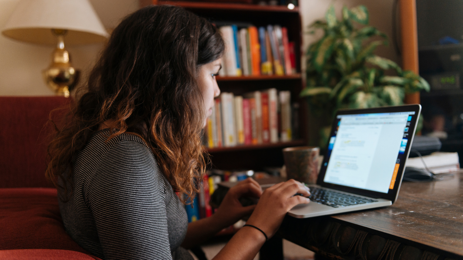 Student studies on their laptop.