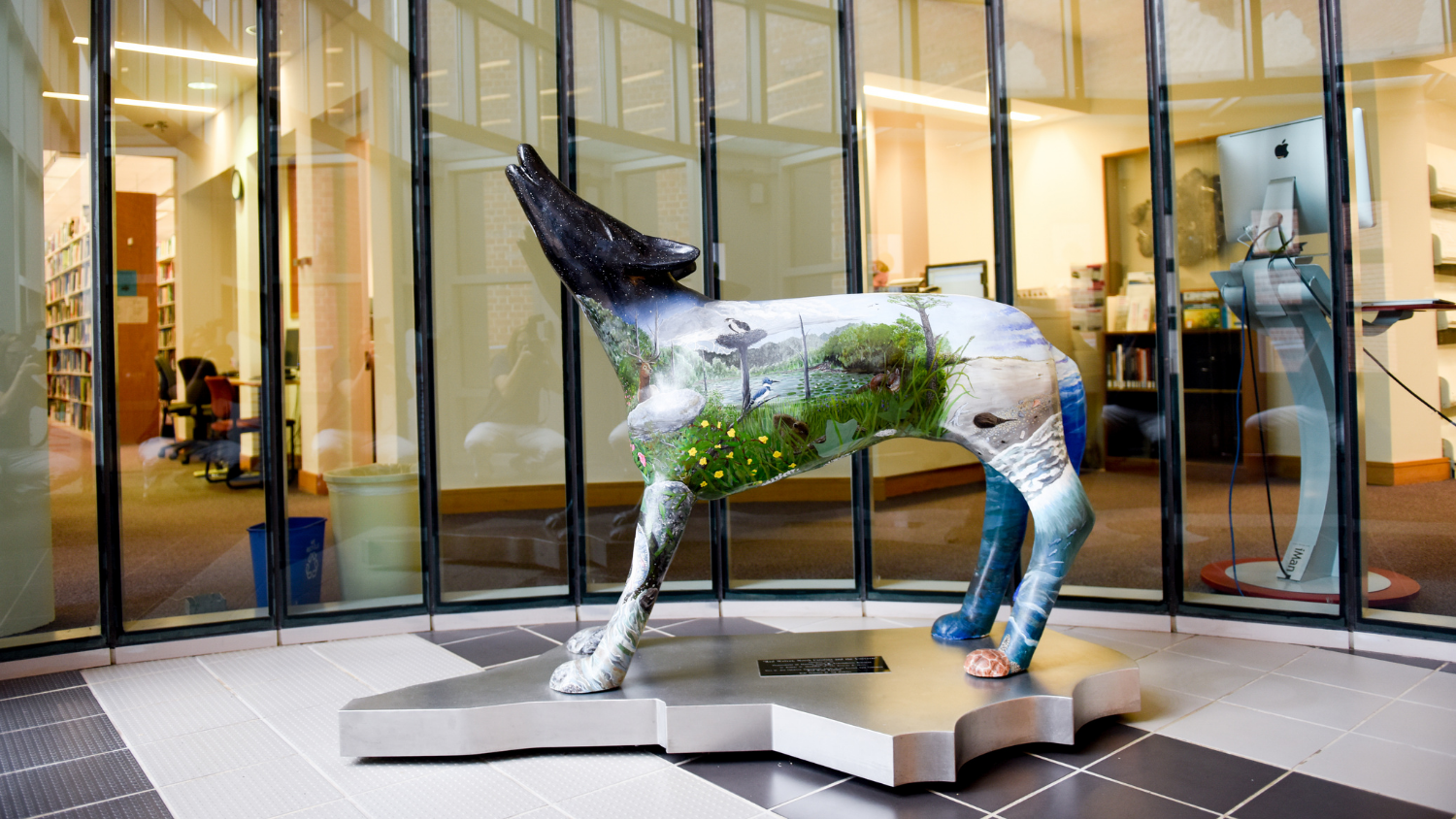 In the lobby of the College of Natural Resources, stands a painted wolf. Photo courtesy of Becky Kirkland.