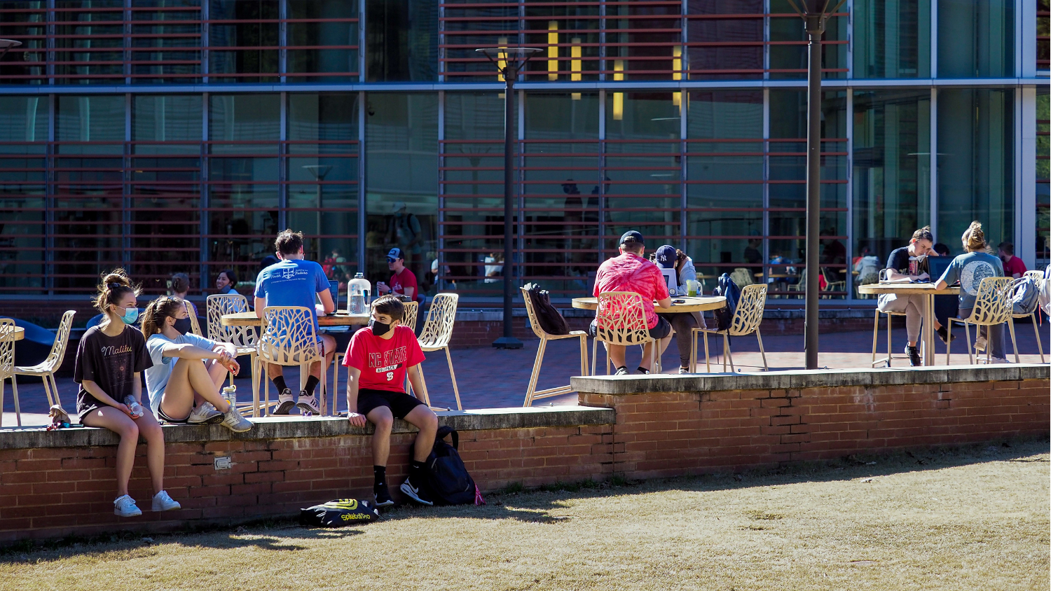 Students picnic in the warm sun at the Court of North Carolina as pleasant weather arrives for the spring 2021 semester.