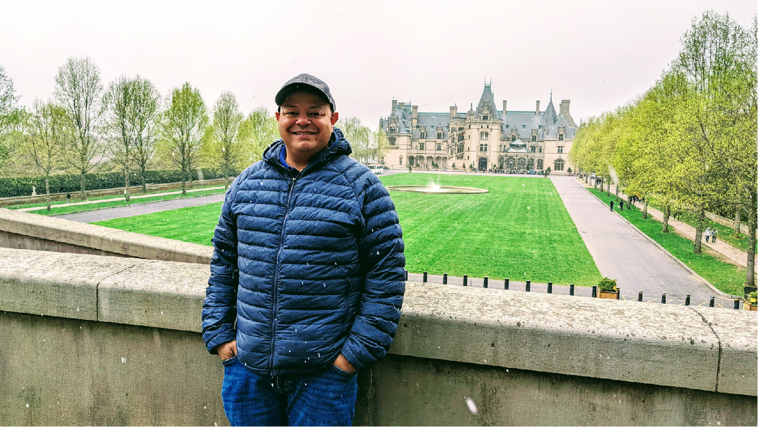 Brandon Pope standing in front of the Biltmore Estate in Asheville, North Carolina.