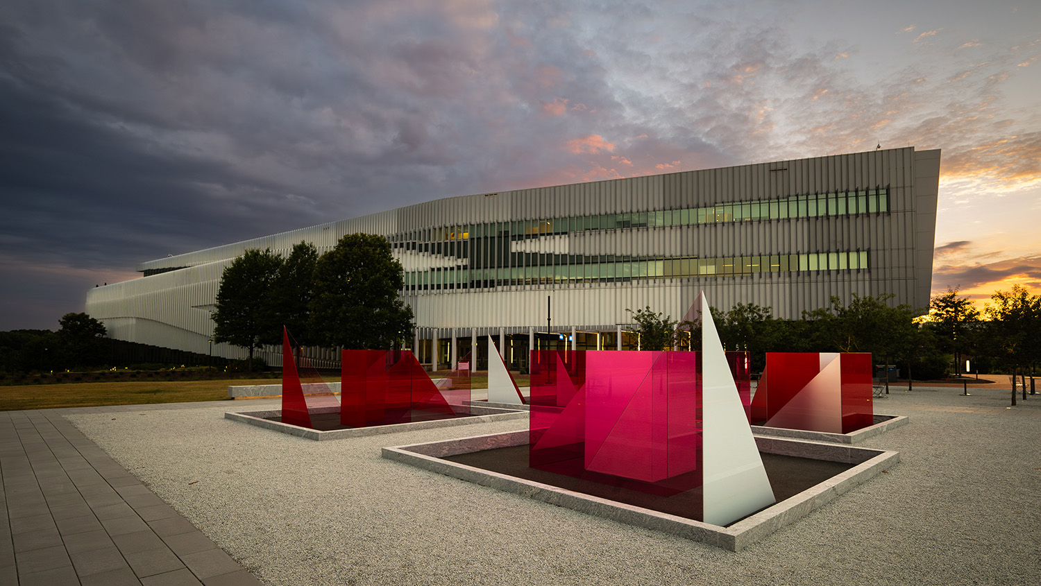 The Hunt library at dusk, on Centennial Campus. In the foreground is the Reds and Whites art installation. Photo by Marc Hall